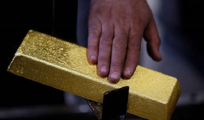 A melter checks an ingot in Ahlatci Metal Refinery in the central Anatolian city of Corum, Turkey, May 11, 2017. Picture taken May 11, 2017. REUTERS/Umit Bektas
